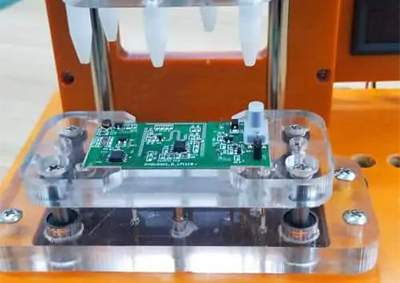 Gan Charger engineers mount the PCB into the ICT fixture